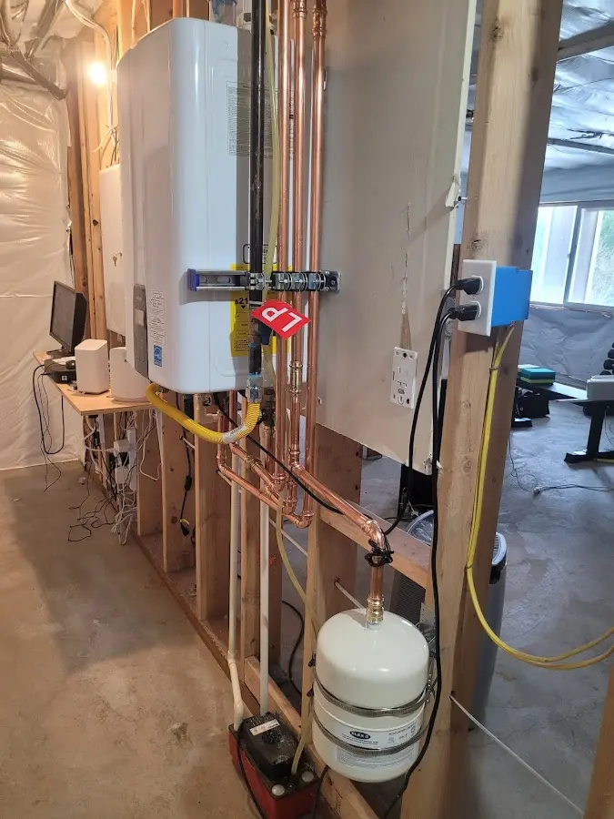 Licensed plumber repairing a kitchen sink in Timberlane